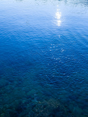 Sun glare on the sea surface, natural colors of the sea water, background