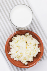 Homemade fermented beverage kefir with kefir grains in bowl on a white background, concept of natural fermented food and gut health