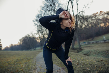 Young athlete exercise at the park. Young woman running at the park