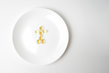 Fish oil capsules on a plate