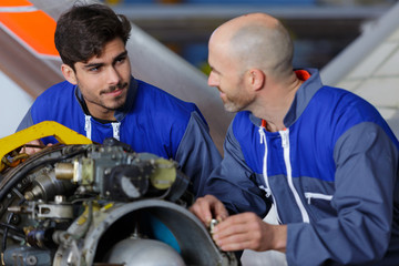 mechanic and flight engineer having a discussion