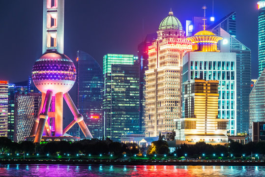 Lujiazui Financial District skyline with Oriental Pearl Tower by night in Shanghai city, China