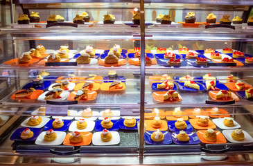Dining Room Buffet aboard the abstract luxury cruise ship. Cakes