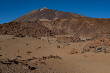 Martian landscape on the eastern slopes of Montana Blanca Mirador las Minas de San Jose with Teide mount at background. Teide National park, Tenerife, Canary islands, Spain