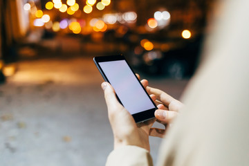 Close-up of female hands using mobile phone