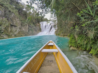 yellow boat point of view (EL SALTO-EL MECO) san luis potosi México, hermosa cascada Turquoise water in a river and cliffs of the reserve. 