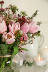 Beautiful bouquet with spring pink tulips on light background