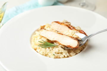 Delicious fresh chicken risotto in plate, closeup