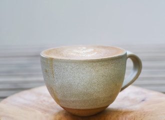 Cup of coffee latte or hot coffee cappuccino cup on wooden table 
