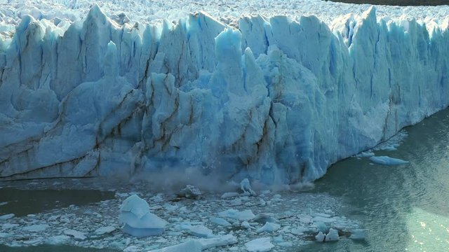 Perito Moreno Glacier in Los Glaciares National Park near El Calafate, Argentina,  view of massive ice chunks collapsing into the water.