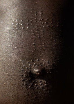 Mundari tribe woman scarifications on the belly in a cross shape, Central Equatoria, Terekeka, South Sudan