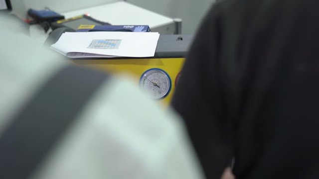 Air conditioner filling machine at car service station slow motion