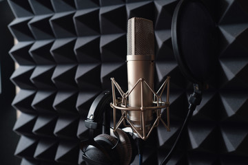 Fototapeta na wymiar Studio microphone in recording studio with acoustic foam
