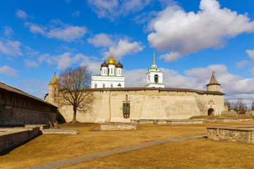 The view of the walls and towers of the medieval fortress is made on a clear spring day. Pskov, Russia.
