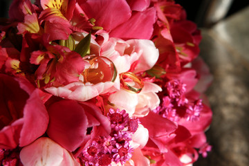 wedding ring and bouquet of flowers