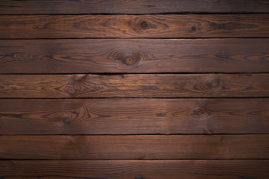 Large and small planks of dark old wood texture background