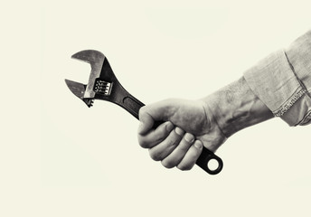 Male hand with black wrench. Concept of technical support. Black and white image.