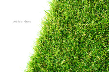 Green artificial grass on a white background, copy space.
