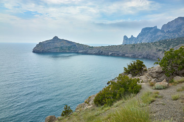 A tourist route along a trail in the mountains of the southern coast of Crimea, a beautiful view of the Black Sea and rocks. Golitsyna trail, Republic of Crimea
