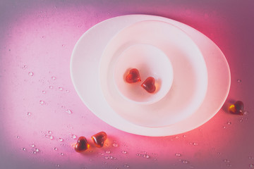 concept of food for lovers.white dishes with love Breakfast lunch dinner hearts. Valentine background