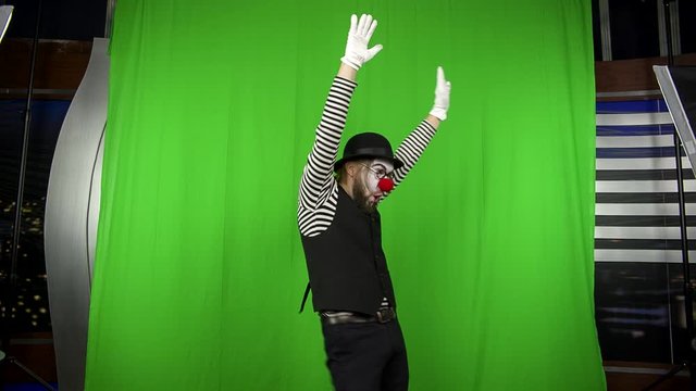 A sketch with a clown. Green screen.