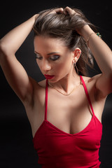 Beautiful woman in red dress studio shot. 