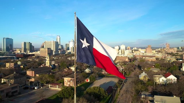 4K Texas Flag Austin Texas Skyline Drone View Orbit Slow Motion