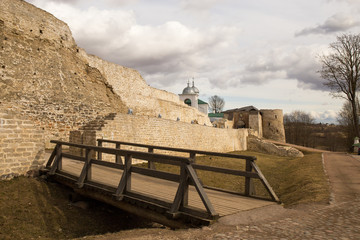 The panorama of the medieval fortress was made on a cloudy spring day. Izborsk, Pskov Region,...
