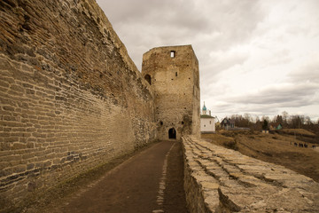 The panorama of the medieval fortress was made on a cloudy spring day. Izborsk, Pskov Region,...