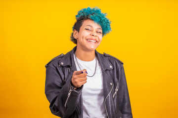 afro american girl with blue curly hair isolated on yellow background