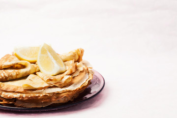 Obraz na płótnie Canvas Shrove Tuesday pancakes with lemon