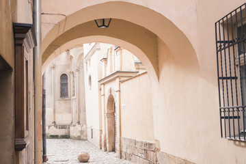 Naklejka premium courtyard with paving stones in an old town with beautiful architecture.
