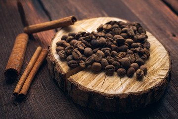 Coffee beans in the form of a heart on a wooden vintage background, the concept of love on Valentine's day