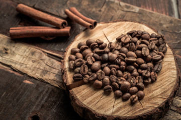 Coffee beans in the form of a heart on a wooden vintage background, the concept of love on Valentine's day