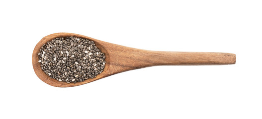 Brown wooden spoon with chia seeds seen directly from above and isolated on white background