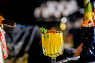 bartender is preparing a cocktail. Bartender is preparing a cocktail for serving