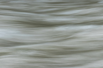 Obraz premium Abstract water background water river. Panned long exposure. Minimalist wallpaper design
