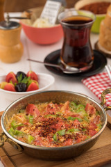 Turkish breakfast with menemen and tea