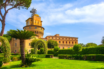 Fototapeta na wymiar Rome, Vatican City, Italy - Alleys of French Garden section of the Vatican Gardens in the Vatican City State with Vatican Radio broadcasting tower in the background