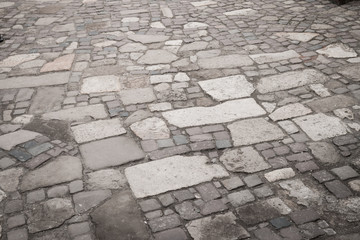 old vintage road. paving stones sidewalk. gray paving stones background.
