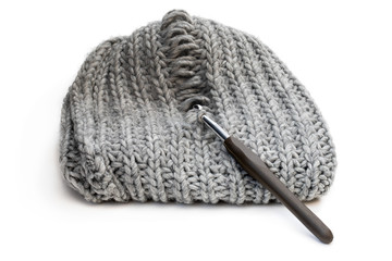 Light grey knitting texture with manufacturing defect isolated on white. Problem solving