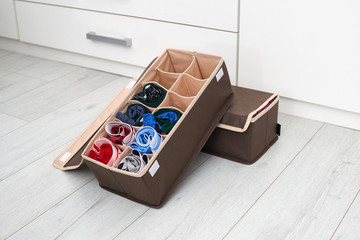 The drawer is divided into cells of different sizes, for separate storage of linen and fabrics....