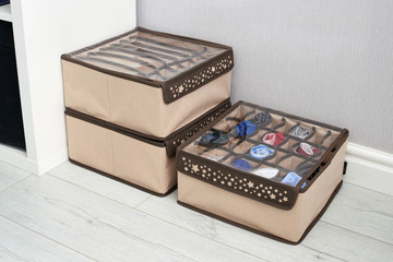 The drawer is divided into cells of different sizes, for separate storage of linen and fabrics. Home storage system for storing clothes. Folding boxes in a set have different shapes.