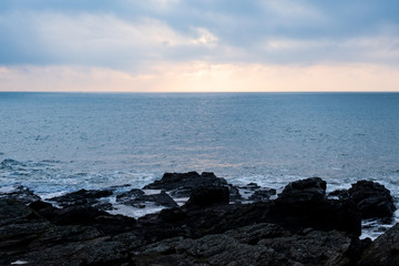 Picture of a seascape during sunset over the Atlantic Ocean, taken during winter.