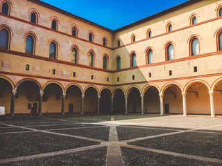 Fototapeta na wymiar Tower Torrione del Carmine, La torre del Filarete and brick walls of old medieval Sforza Castle Castello Sforzesco. Milan, Lombardy, Italy
