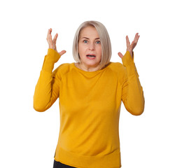 Attractive Middle Aged Woman expresses fear and horror, panic and cry, hysterics and problem, surprise and fright. Woman in bright clothes posing in studio on white background