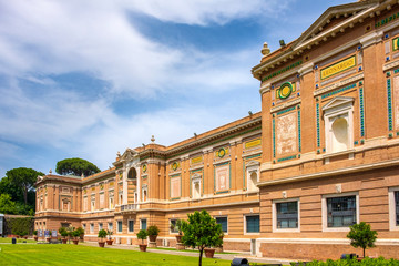 Fototapety  Rome, Vatican City, Italy - Panoramic view of the Vatican Museums with its Pinacotheca art gallery building of Leonardo da Vinci and the Square Garden