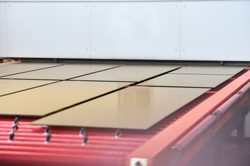 painted glass panes on the conveyor