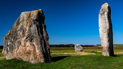 Standing stones that form part of the ancient megalith circle in the village of Avebury in Wiltshire, England, United Kingdom