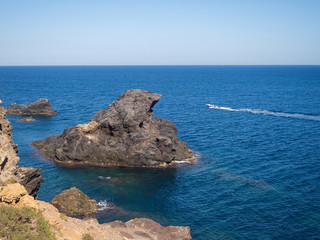 Obraz premium Motor boat is on the blue sea. Spain
